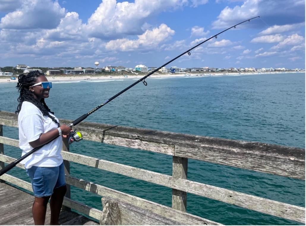 Woman Fishing at the Pier