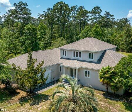 Aerial view of a house with palm trees